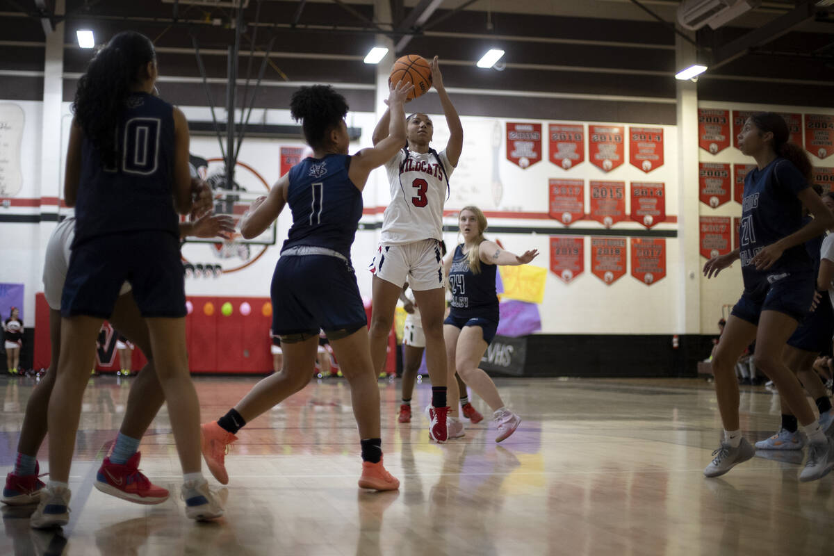 Las Vegas’ Vernonie Newson (3) shoots against Spring Valley’s Mia Ervin (1) durin ...