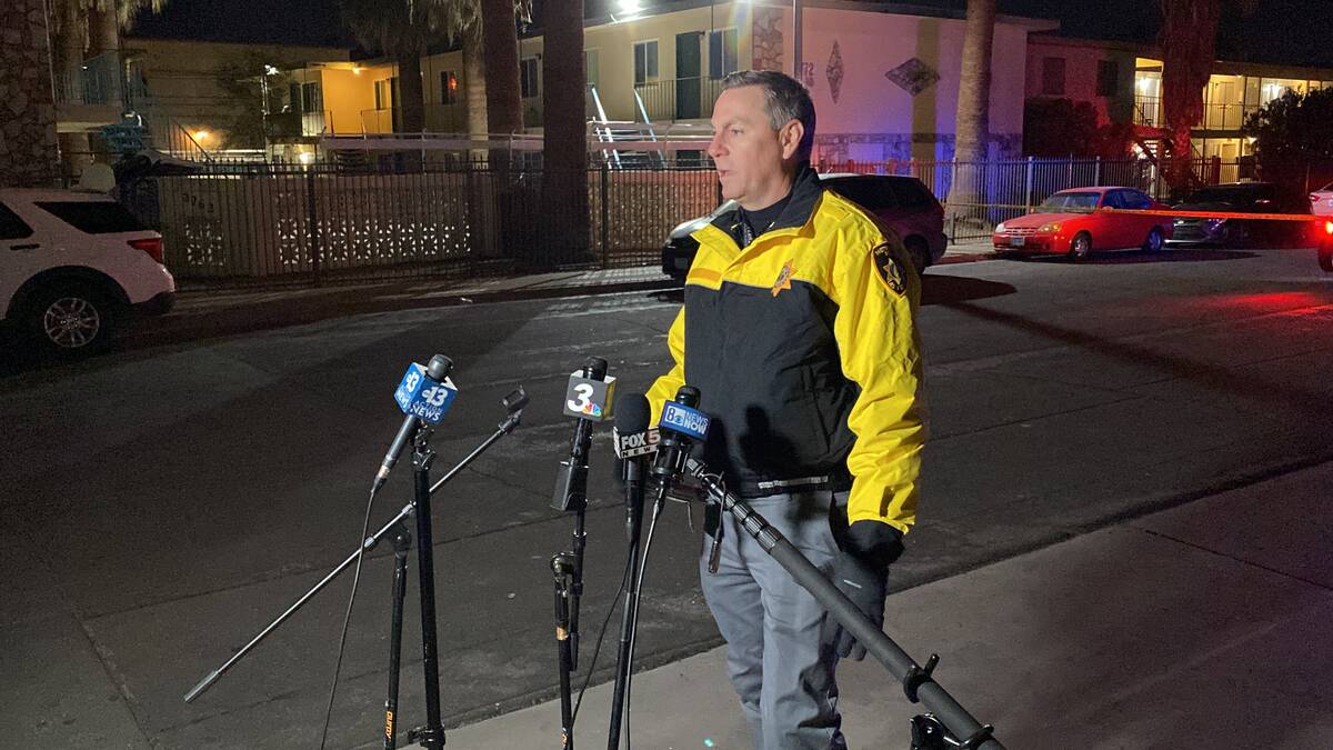 Metropolitan Police Department Lt. Jason Johansson speaks to the media at the scene of a homici ...