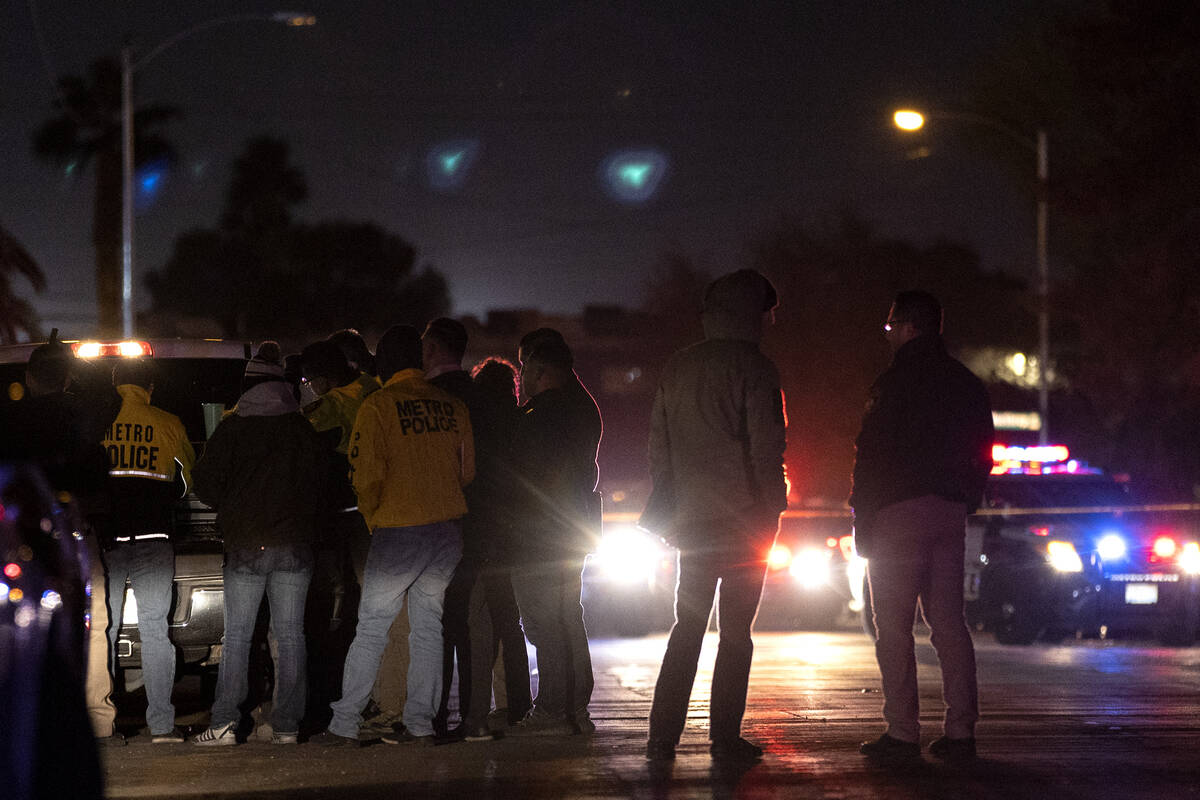 Metropolitan police investigate a homicide in the 3800 block of Royal Crest Street on Thursday, ...