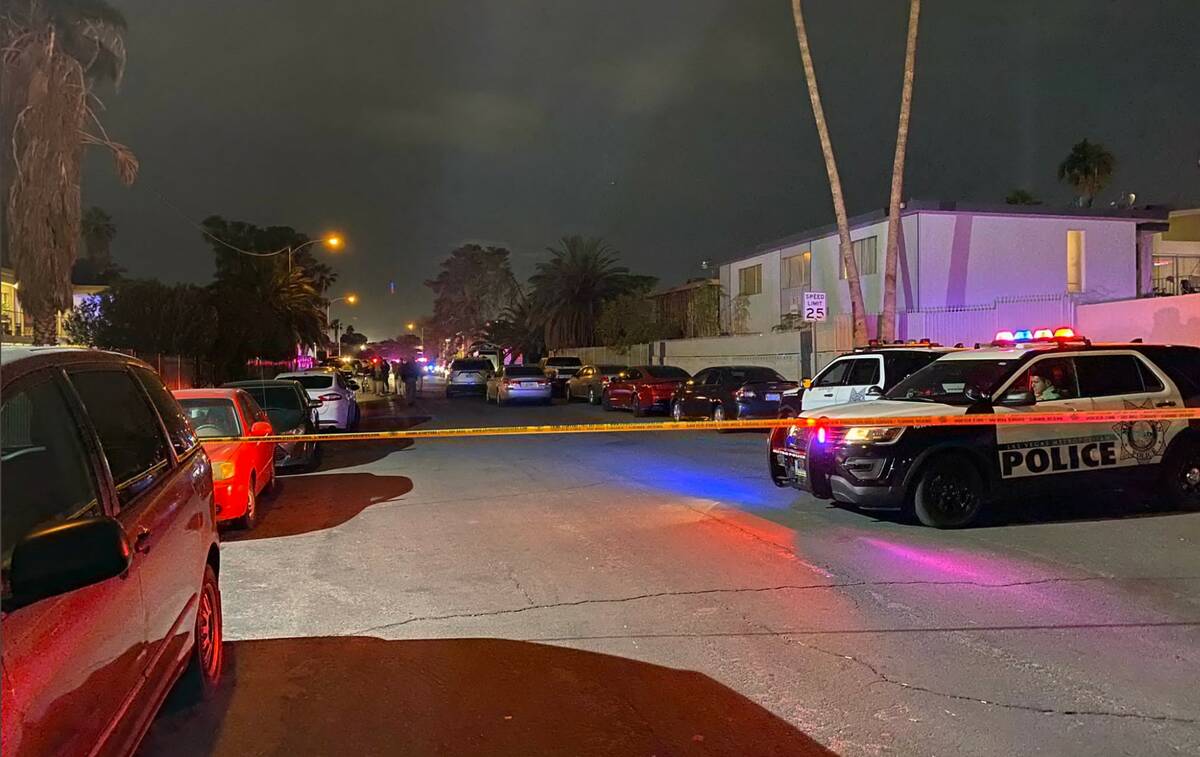 Las Vegas police investigate the scene of a homicide near the 3800 block of Royal Crest Street ...
