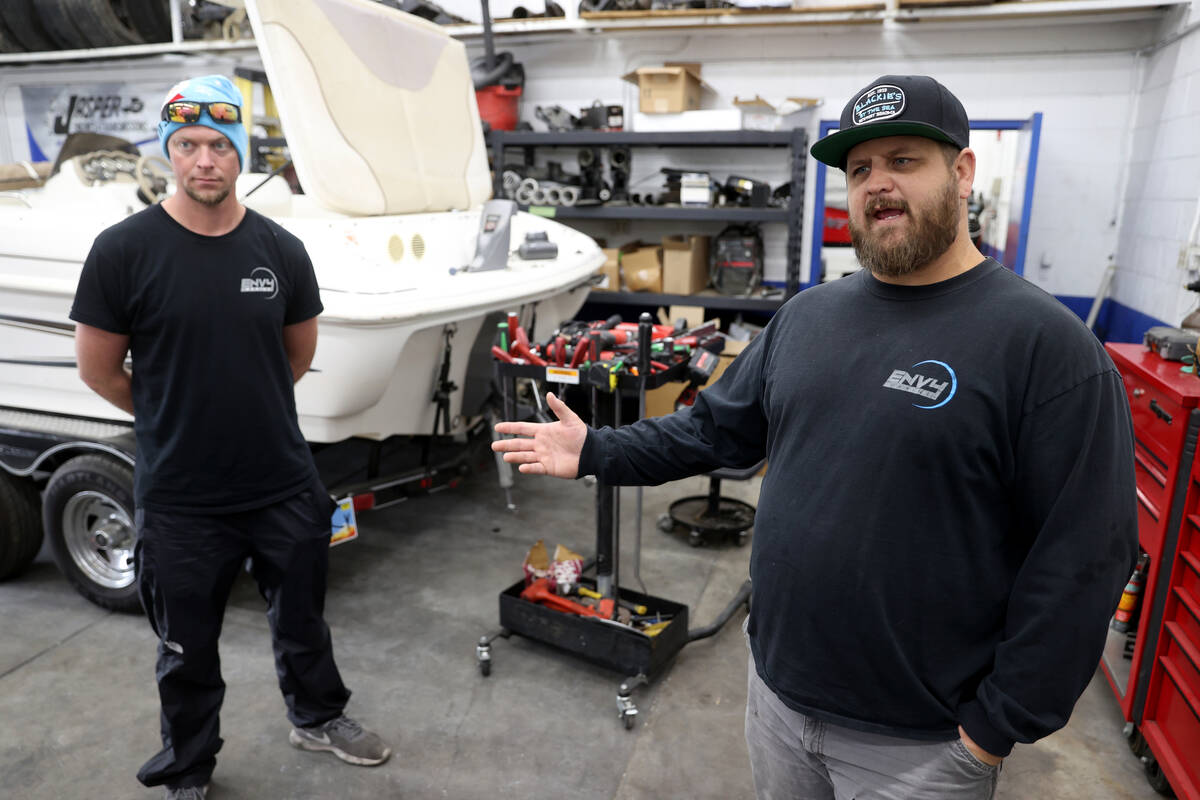 Corey Obermeyer, owner of Envy Marine in Boulder City, talks to a reporter at his shop as mecha ...