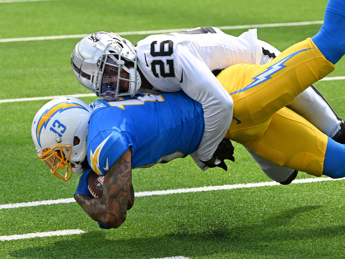 Los Angeles Chargers wide receiver Keenan Allen (13) is tackled after catching a pass by Las Ve ...