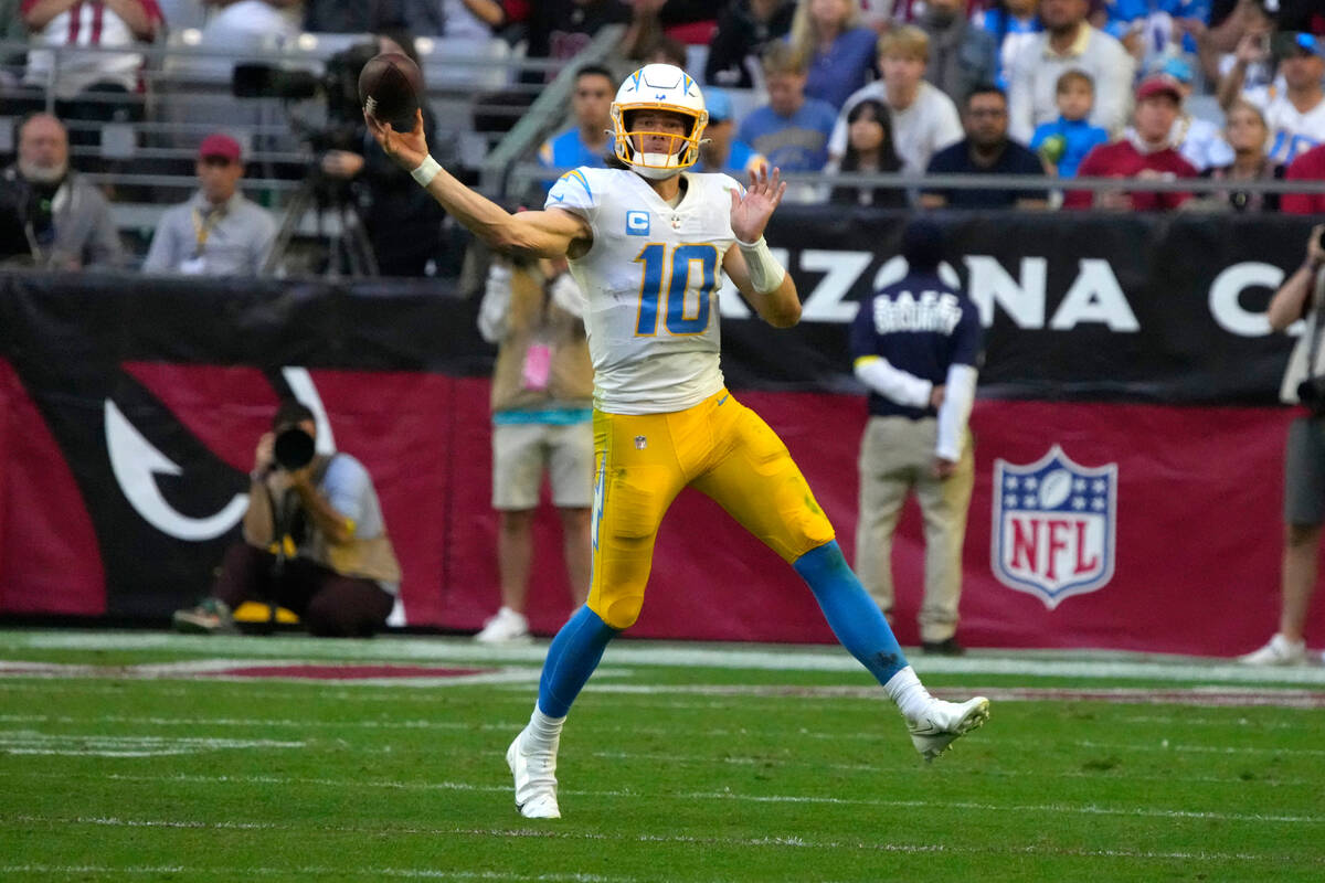 Los Angeles Chargers quarterback Justin Herbert (10) during the first half of an NFL football g ...