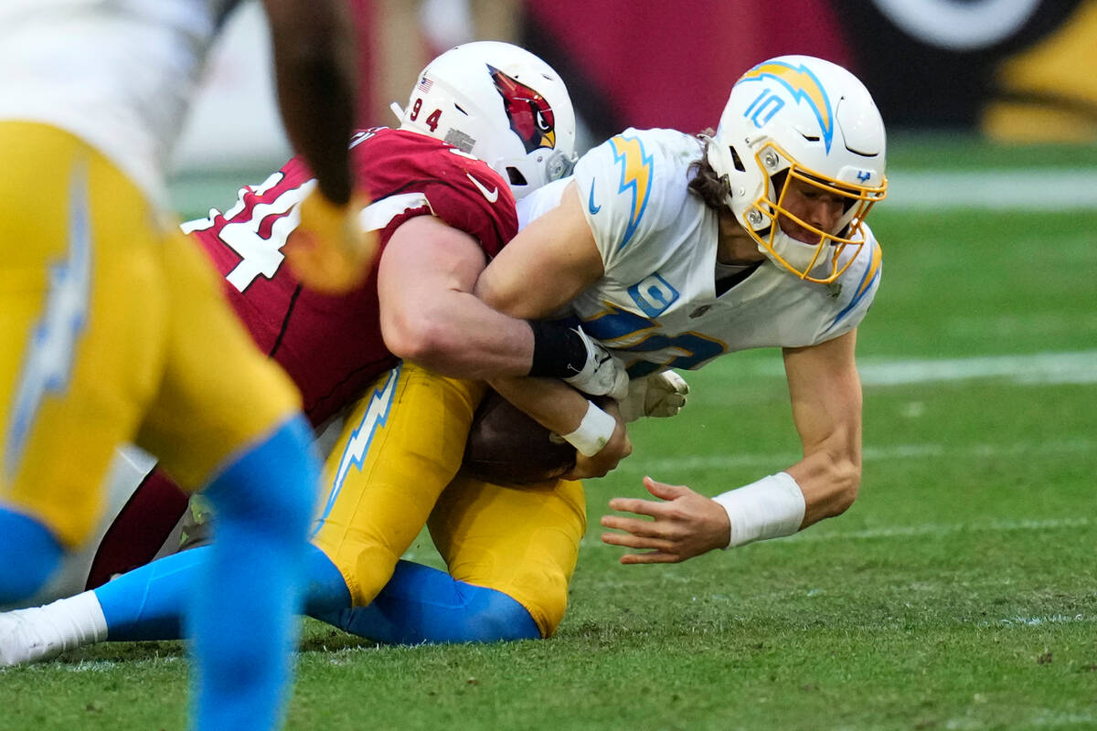 Arizona Cardinals defensive end Zach Allen (94) sacks Los Angeles Chargers quarterback Justin H ...