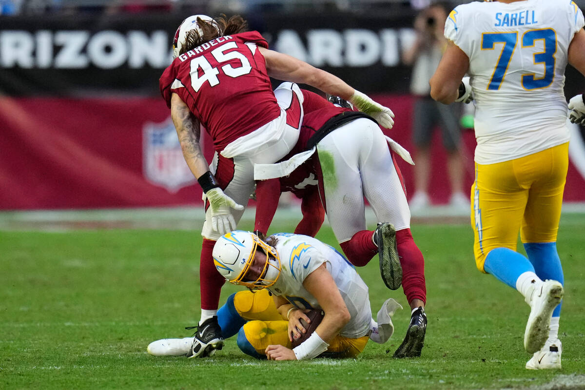 Los Angeles Chargers quarterback Justin Herbert (10) is sacked by Arizona Cardinals linebacker ...