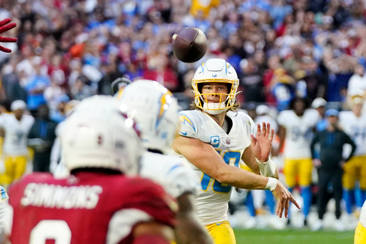 Los Angeles Chargers quarterback Justin Herbert throws for the winning two-point conversion aga ...