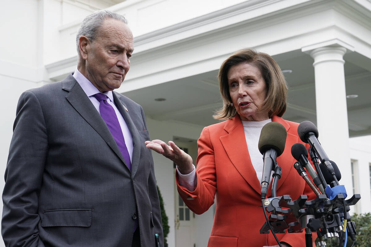 FILE - Senate Majority Leader Chuck Schumer of N.Y., right, listens as House Speaker Nancy Pelo ...
