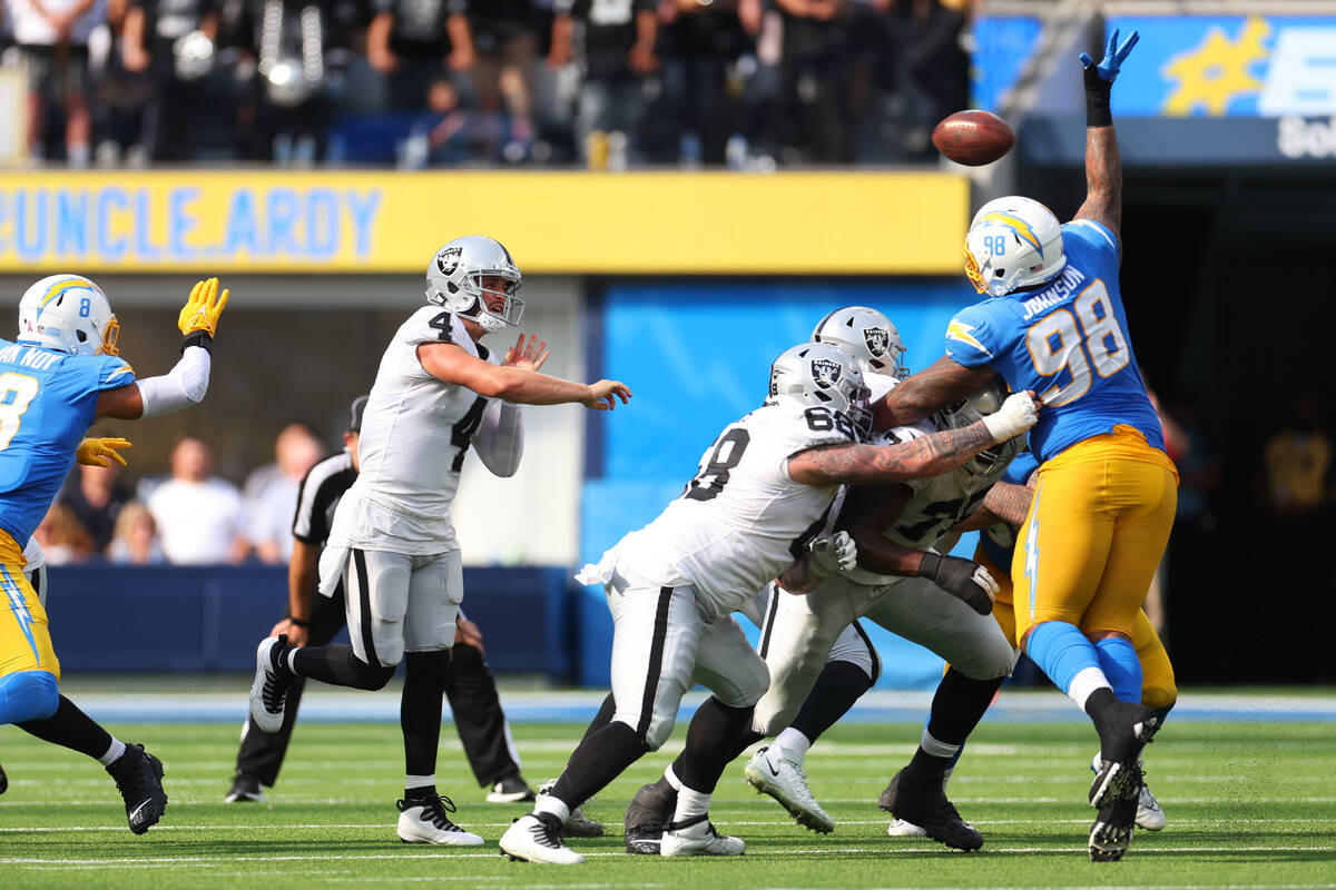 Raiders quarterback Derek Carr (4) throws the ball during the second half of a NFL football gam ...
