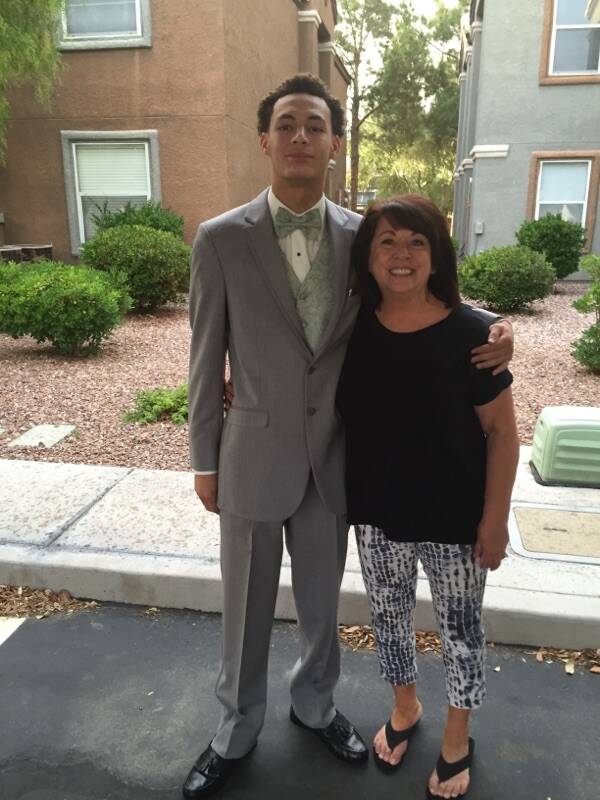 Gianni Corsentino, dressed for his senior prom, puts his arm around his grandmother, Jeanie Lat ...