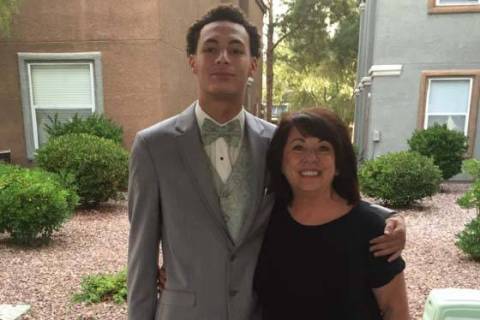 Gianni Corsentino, dressed for his senior prom, puts his arm around his grandmother, Jeanie, in ...