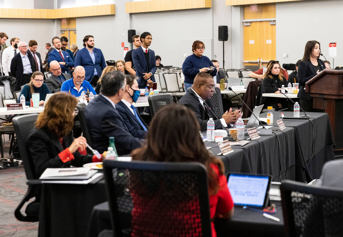 Vanessa Booth, right, editor-in-chief of The Scarlet & Gray Free Press, speaks during the Board ...