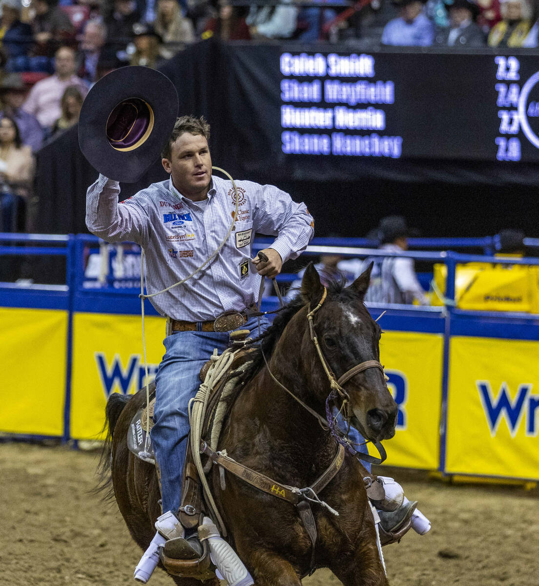 Caleb Smidt of Bellville, Texas, celebrates a winning time in Tie-Down Roping during the Nation ...