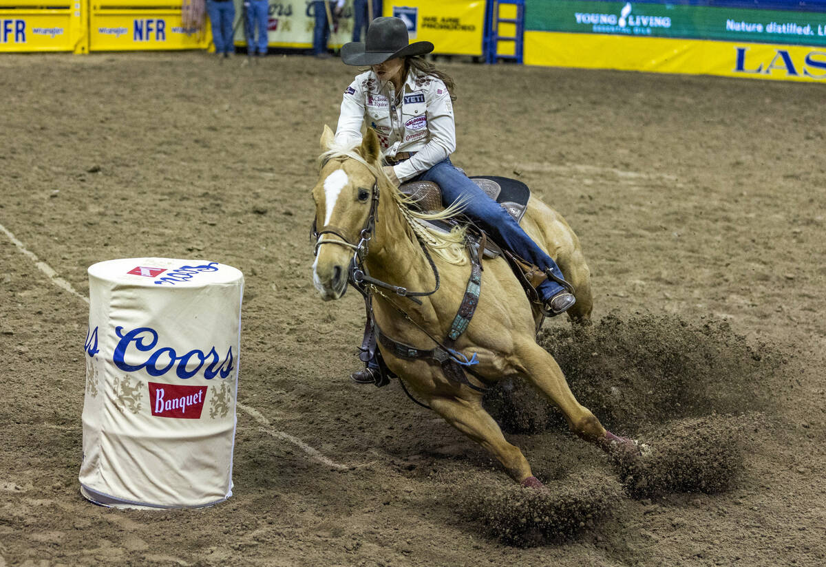 Hailey Kinsel of Cotulla, Texas, rounds the first barrel on her winning time during Barrel Raci ...