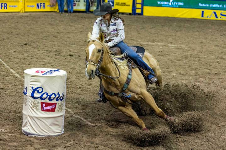 Hailey Kinsel of Cotulla, Texas, rounds the first barrel on her winning time during Barrel Raci ...