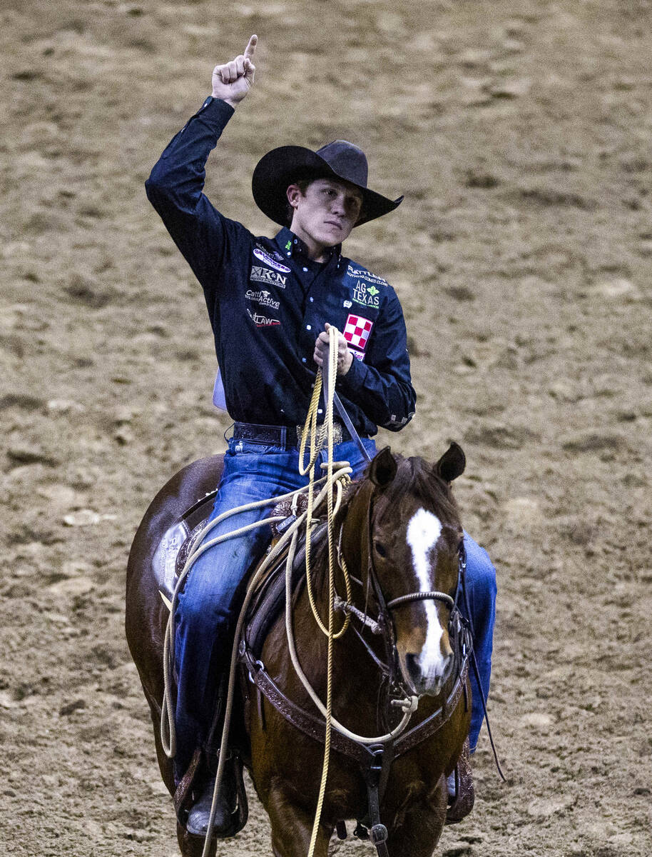 Marty Yates on Stephenville, TX., celebrates his winning ride during Tie-Down Roping in the Nat ...