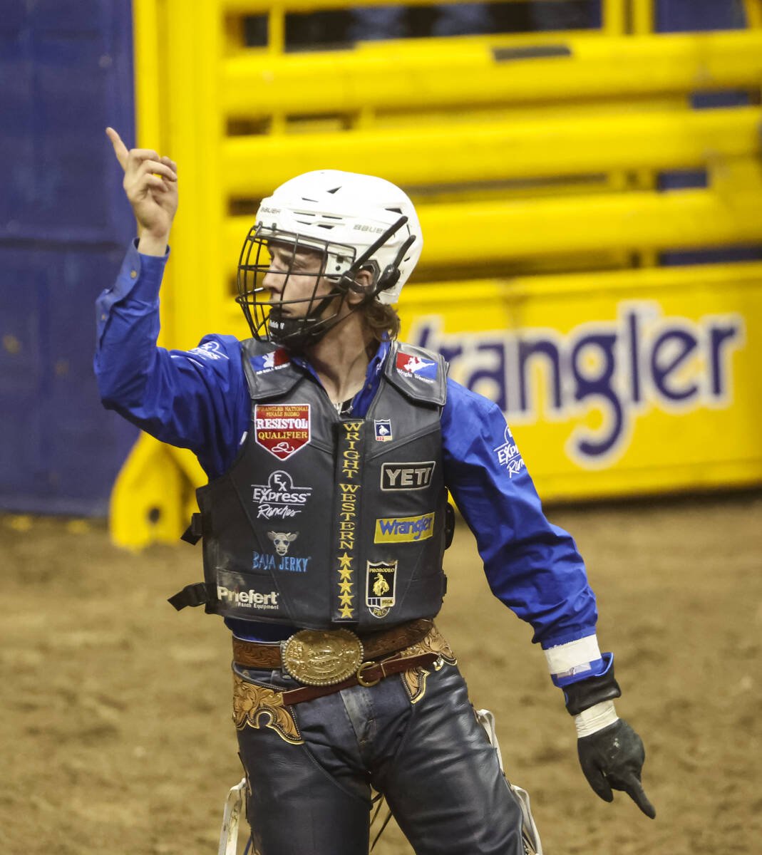 Stetson Wright, of Milford, Utah, celebrates after riding Relentless while competing in bull ri ...