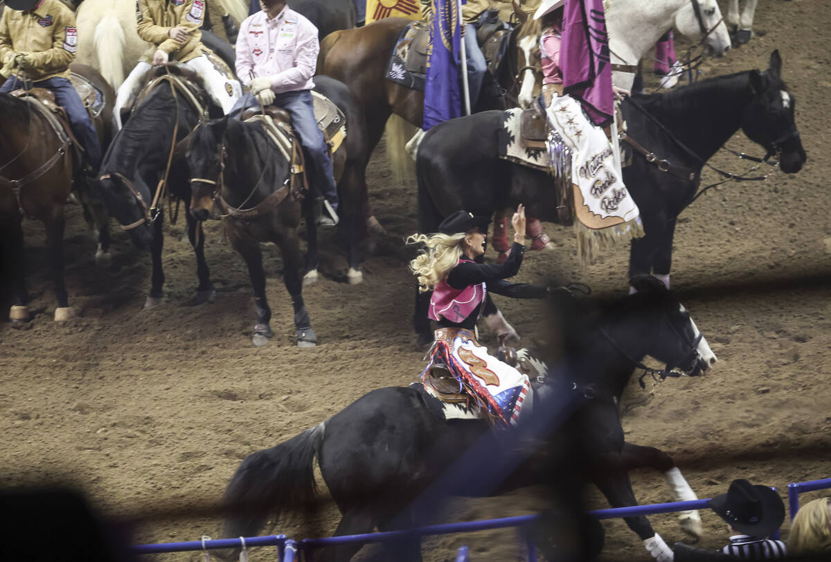 Miss Rodeo America Hailey Frederiksen acknowledges the crowd during the fifth go-round of the N ...