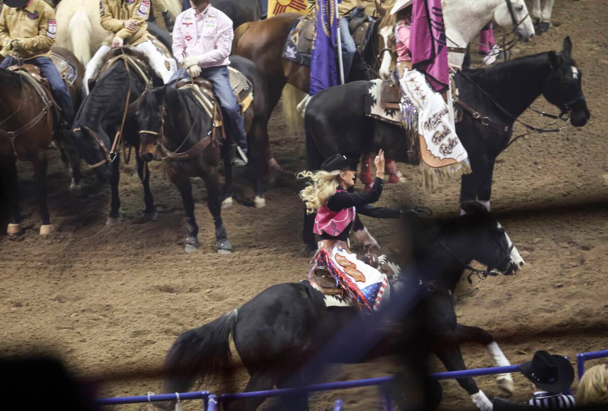 Miss Rodeo America Hailey Frederiksen acknowledges the crowd during the fifth go-round of the N ...