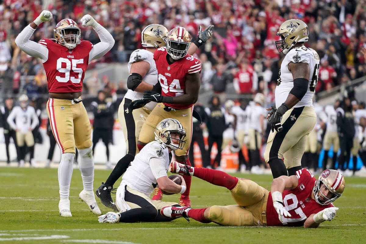 San Francisco 49ers defensive end Drake Jackson (95) reacts after defensive end Nick Bosa, bott ...