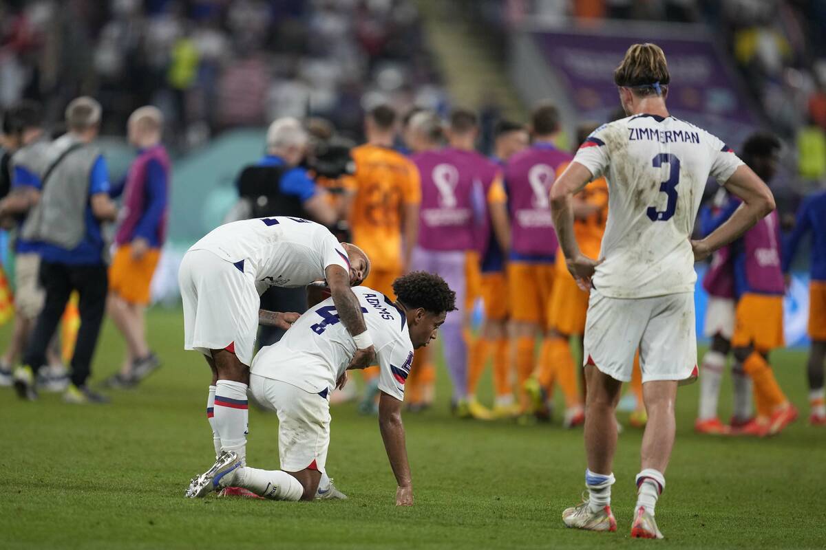 U.S. players react at the end of the World Cup round of 16 soccer match between the Netherlands ...