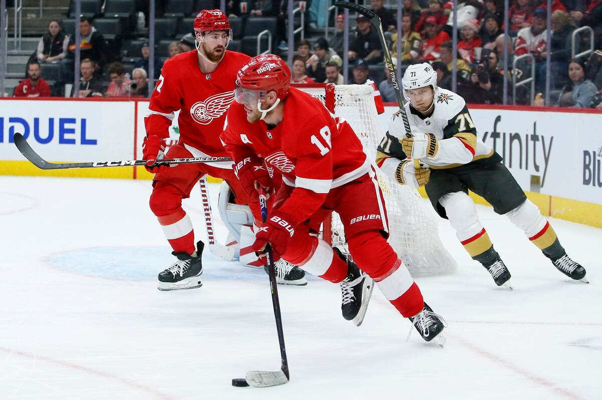 Detroit Red Wings center Andrew Copp (18) is pursued by Vegas Golden Knights center William Kar ...
