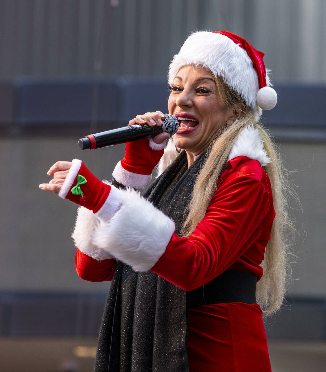 Gabriella Versace sings a holiday song during the pre-race entertainment from the Fremont Stree ...