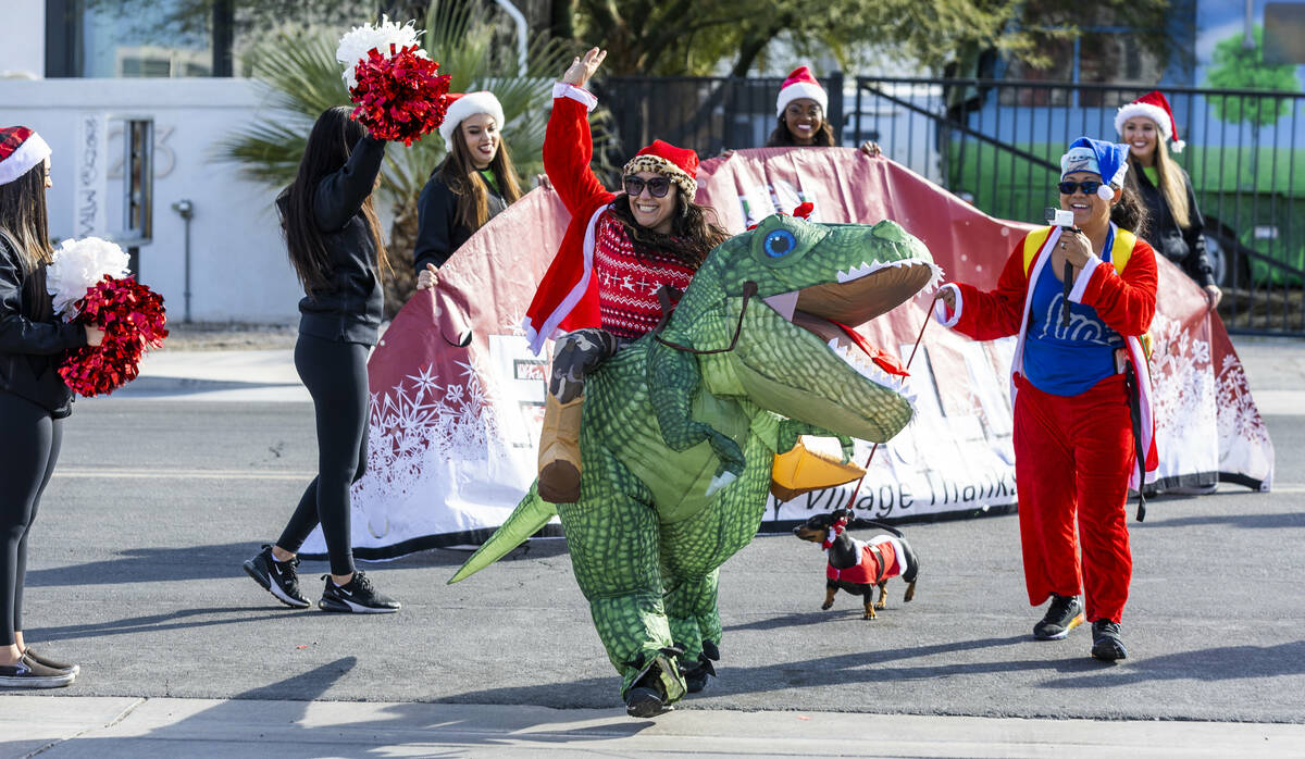 Participant Raquel Torres and Dino finish the 5K race at the Llama Lot during the 18th Annual G ...