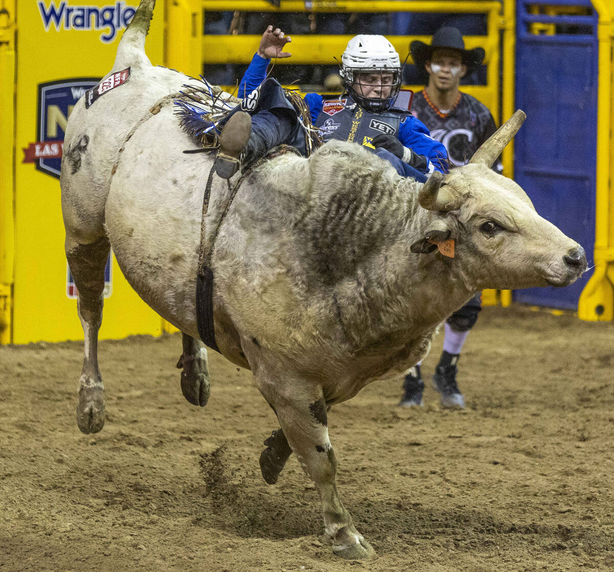 Stetson Wright of Milford, Utah, rides Pookie Holler to a winning score in Bull Riding during t ...