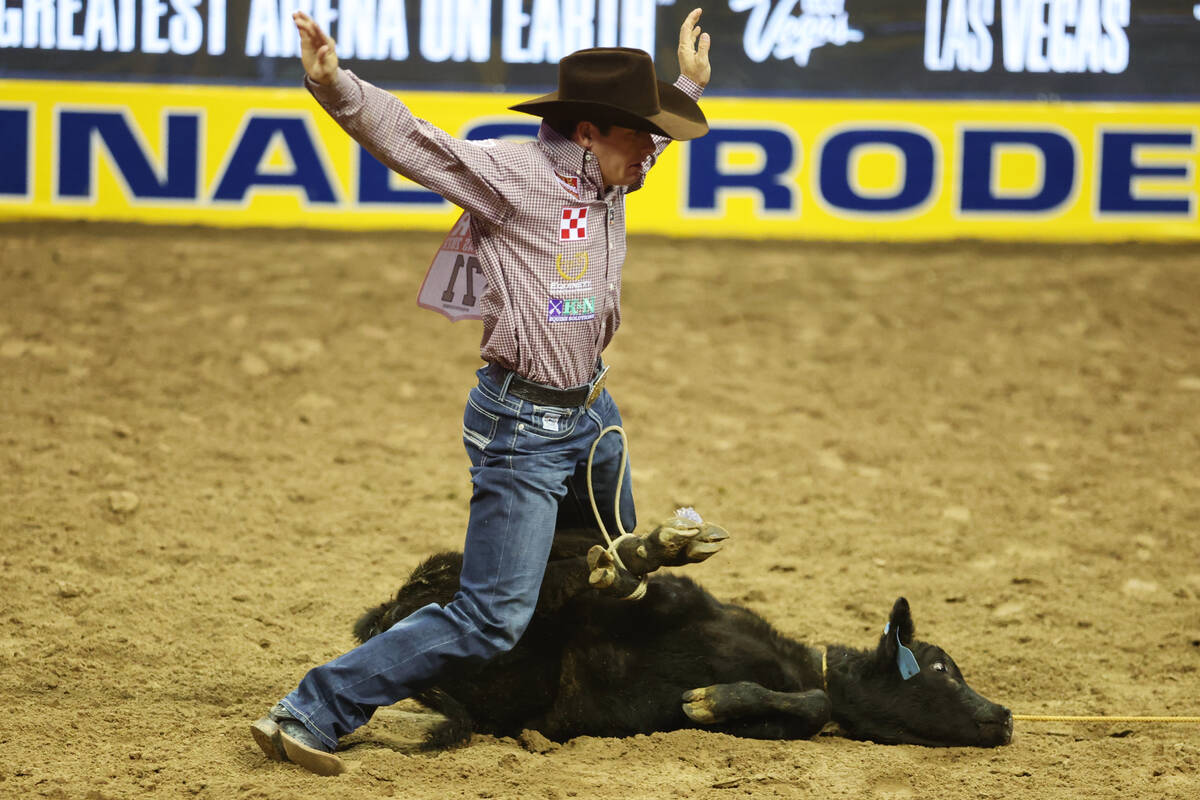 Macon Murphy competes in the tie-down roping event during the 64th Wrangler National Finals Rod ...