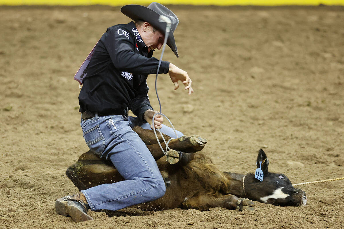 Tuf Cooper competes in the tie-down roping event during the 64th Wrangler National Finals Rodeo ...