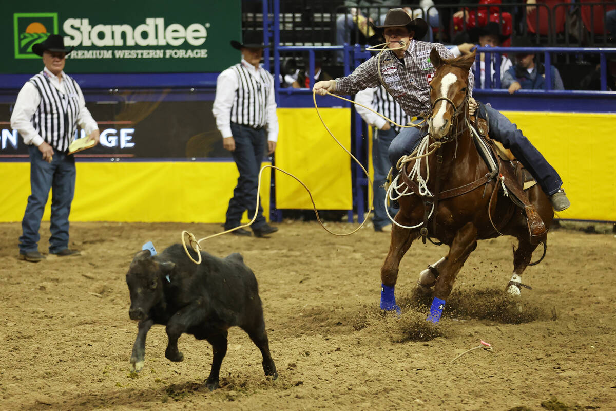 Marty Yates competes in the tie-down roping event during the 64th Wrangler National Finals Rode ...