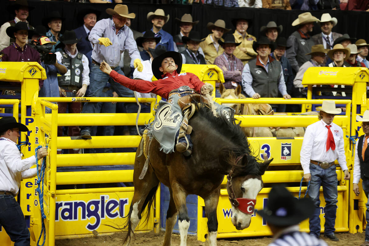 Taner Butner competes in the saddle bronc riding event during the 64th Wrangler National Finals ...