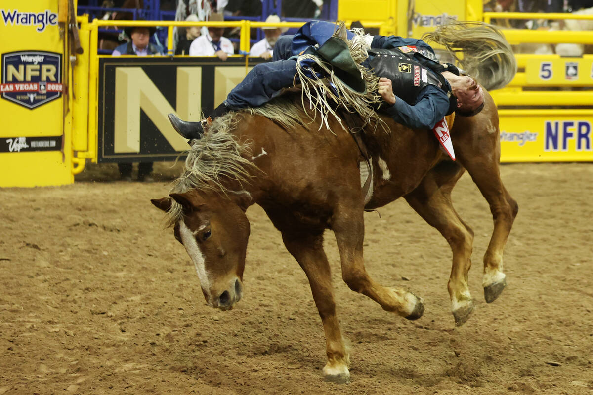 Orin Larsen competes in the bareback riding event in the 64th Wrangler National Finals Rodeo at ...
