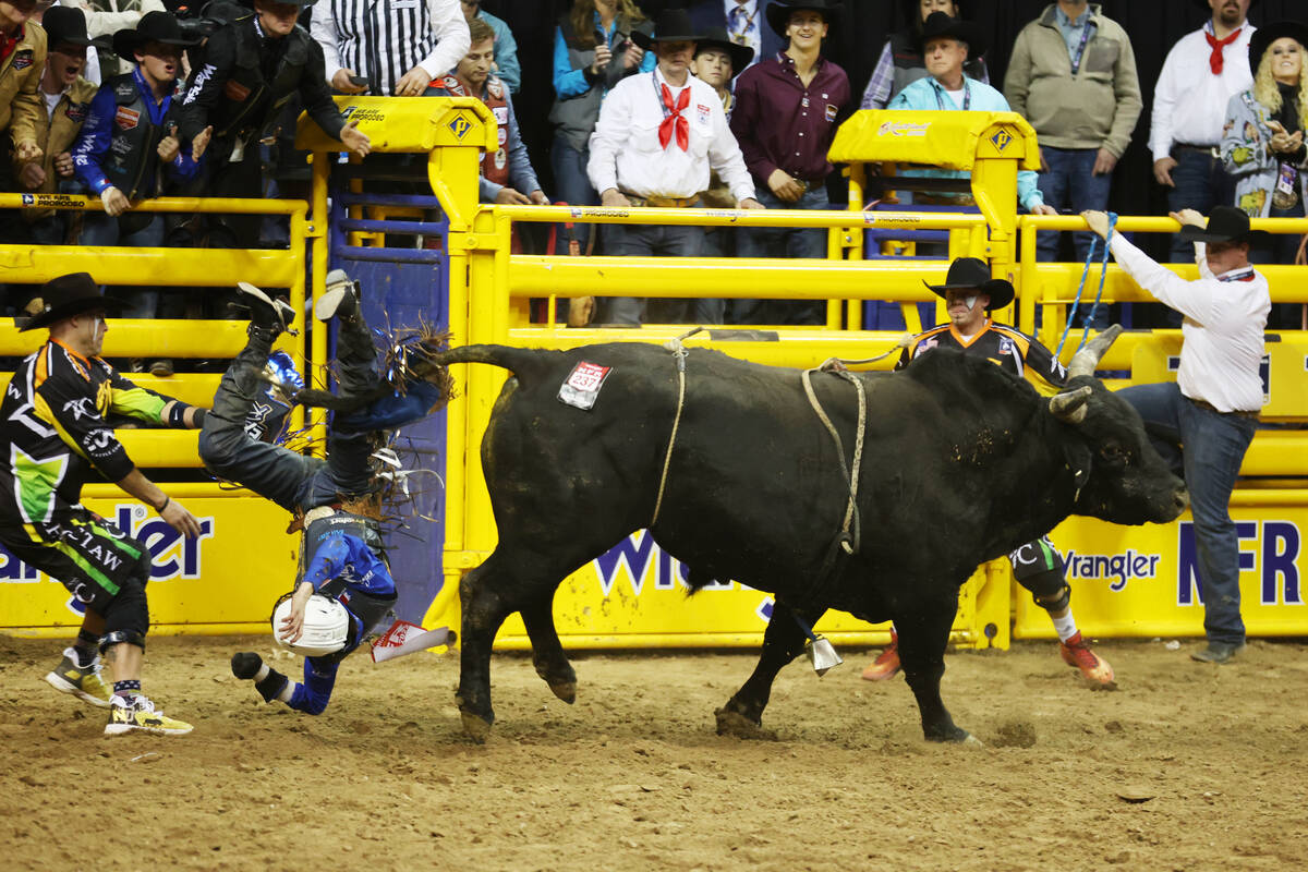 Stetson Wright falls from a bull during the bull riding competition in the 64th Wrangler Nation ...
