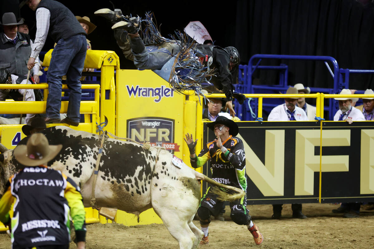 Tristen Hutchings gets tossed in the air by a bull during the bull riding competition in the 64 ...