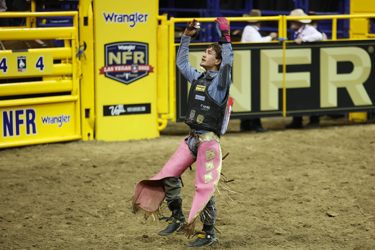 JR Stratford reacts after his run in the bull riding event in the 64th Wrangler National Finals ...