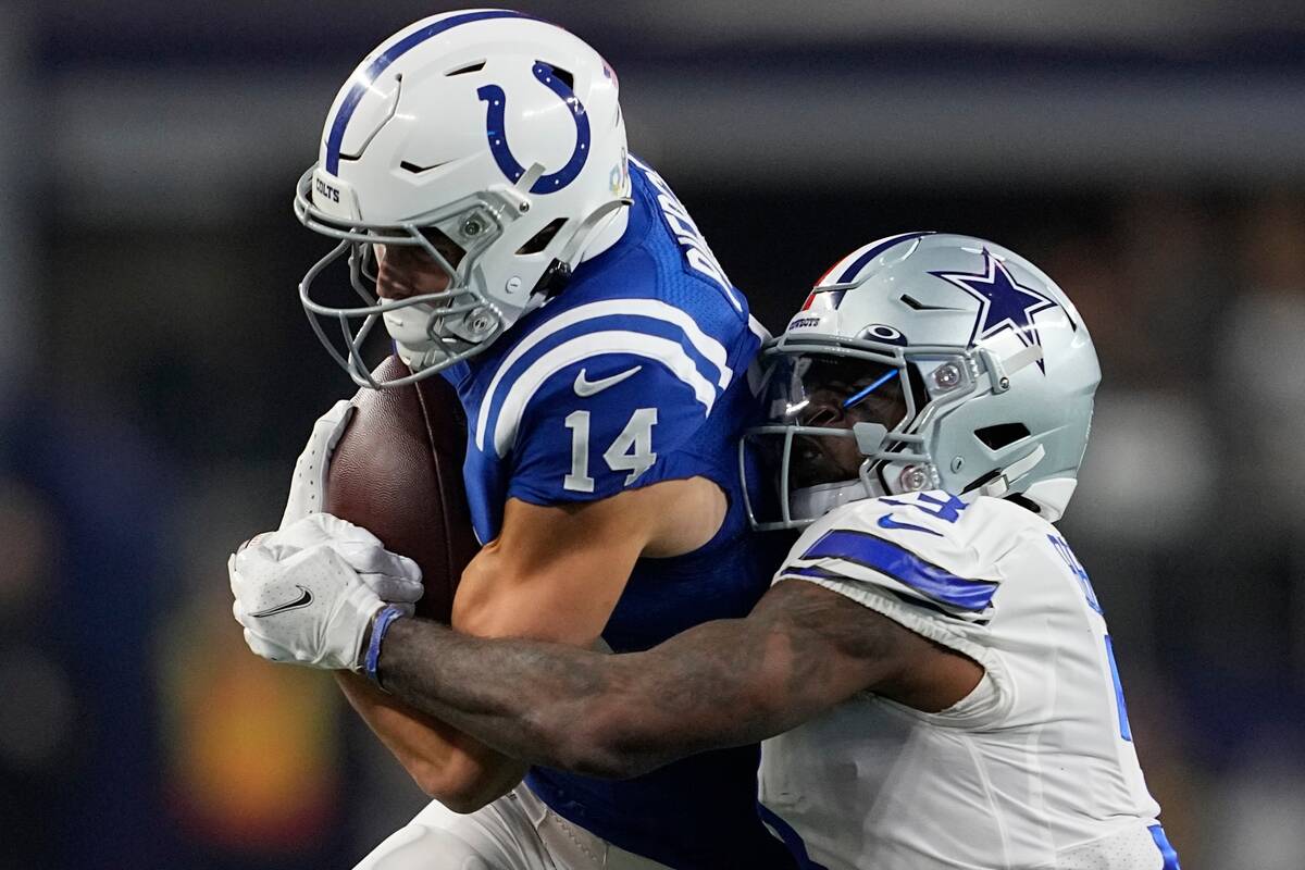 Indianapolis Colts' Alec Pierce (14) is tackled by Dallas Cowboys' Anthony Brown (3) during the ...