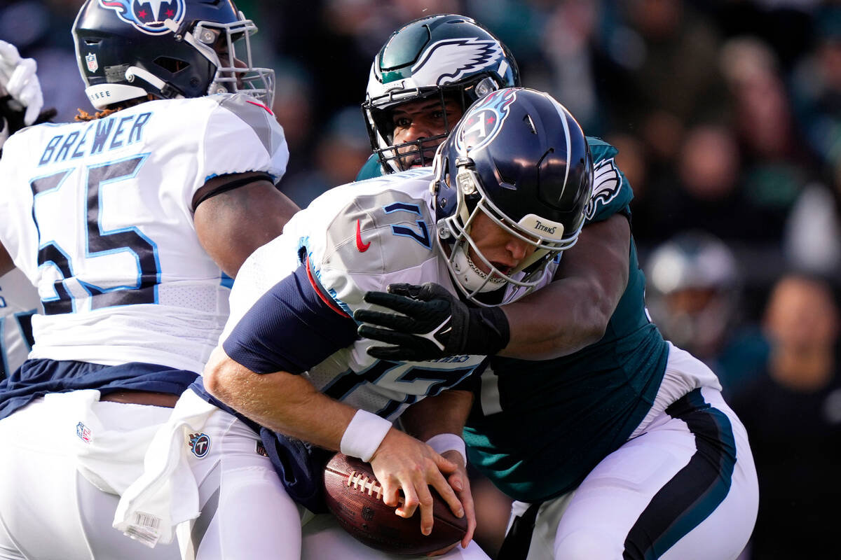 Philadelphia Eagles' Javon Hargrave stops Tennessee Titans' Ryan Tannehill during the first hal ...