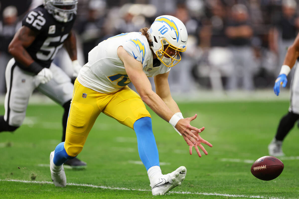 Los Angeles Chargers quarterback Justin Herbert (10) fumbles the ball during the first half of ...