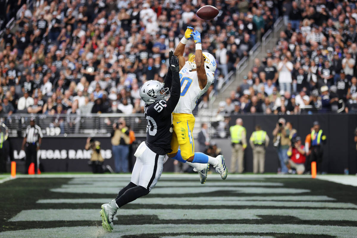 Raiders linebacker Jayon Brown (50) defends a pass to Los Angeles Chargers running back Austin ...