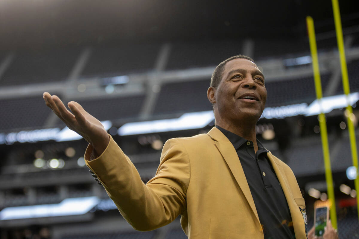 Raiders Hall of Fame running back Marcus Allen speaks to fans before an NFL game between the Ra ...