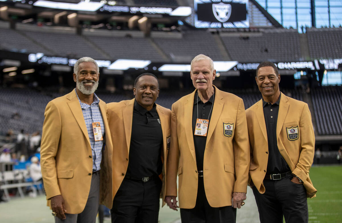 Raiders Hall of Famers, from left, Mike Haynes, Tim Brown, Ted Hendricks and Marcus Allen, pose ...
