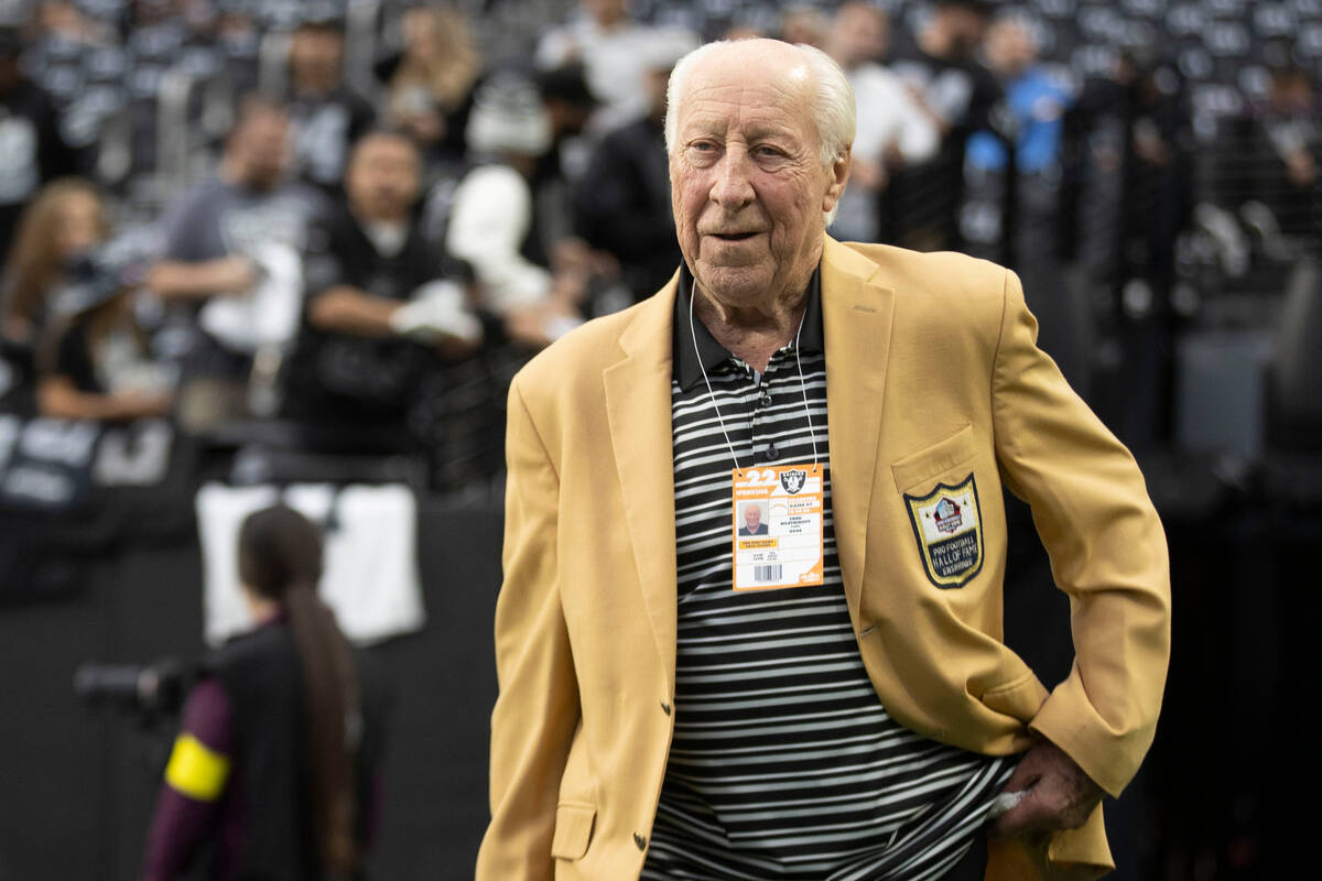 Raiders Hall of Fame wide receiver Fred Biletnikoff walks on the field before an NFL game betwe ...