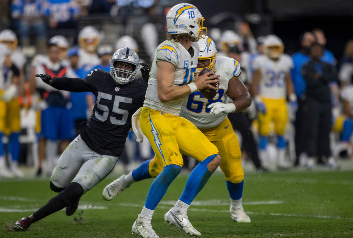 Raiders defensive end Chandler Jones (55) closes in on Los Angeles Chargers quarterback Justin ...
