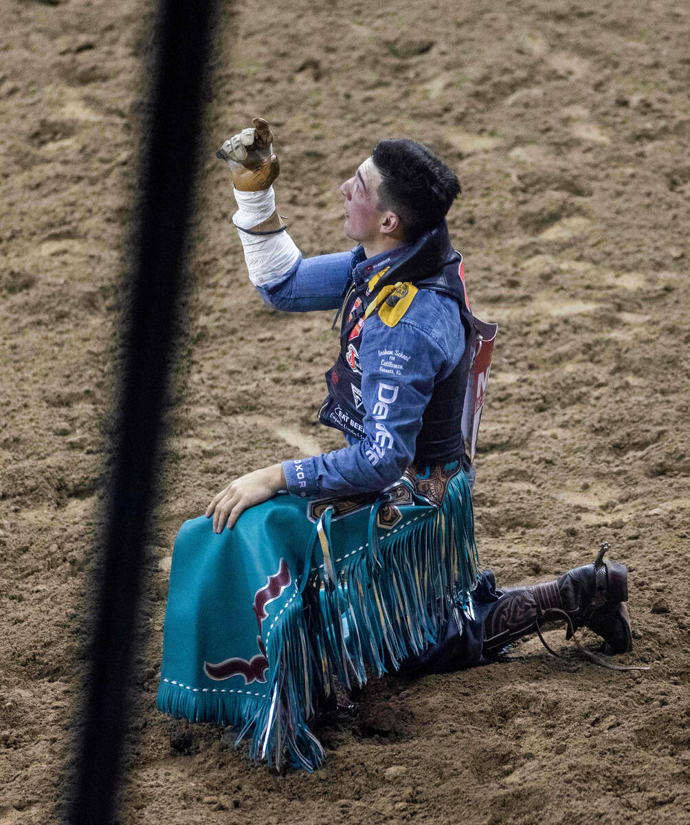 Jess Pope of Waverly, Kan., is pleased with a great ride during Bareback Riding in the Nationa ...