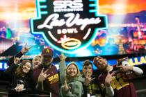 Arizona State Sun Devils fans pose for photos before the Las Vegas Bowl NCAA college football g ...