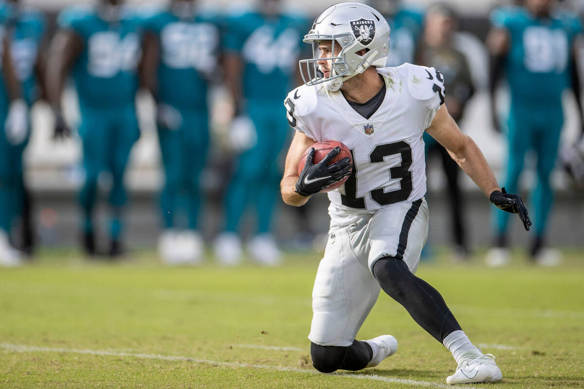 Raiders wide receiver Hunter Renfrow (13) looks for room to run on a punt return during the sec ...