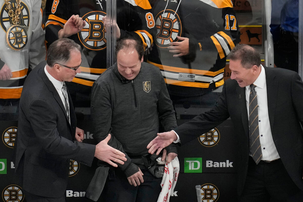 Vegas Golden Knights head coach Bruce Cassidy, right, is congratulated after defeating the Bost ...