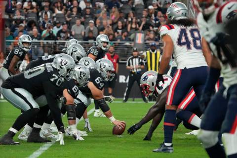 The Raiders line up against the New England Patriots during the first half of an NFL preseason ...