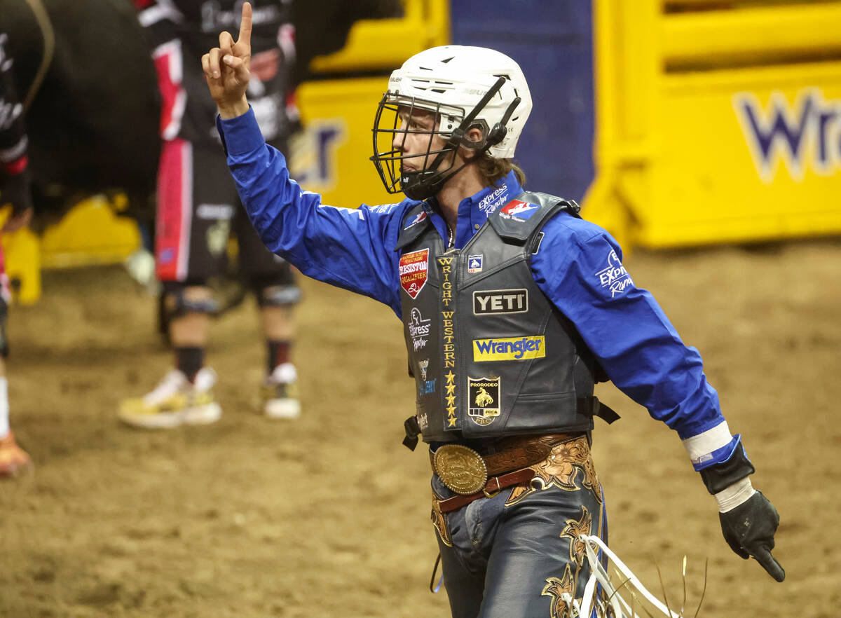 Stetson Wright, of Milford, Utah, celebrates after riding Relentless while competing in bull ri ...